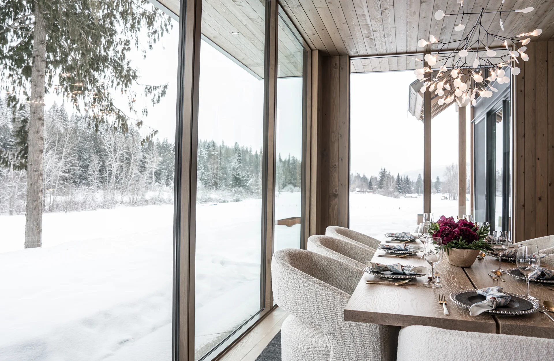 Dining table set for eight with lake and mountain views